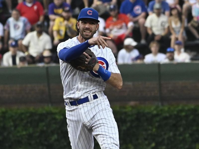 Jun 29, 2023; Chicago, Illinois, USA;  Chicago Cubs shortstop Dansby Swanson (7) throws out Philadelphia Phillies second baseman Bryson Stott (5) at first base during the second inning at Wrigley Field. Mandatory Credit: Matt Marton-USA TODAY Sports