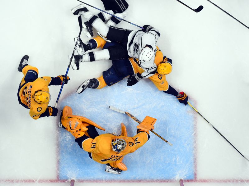 Jan 21, 2023; Nashville, Tennessee, USA; Nashville Predators goaltender Juuse Saros (74) makes a save in traffic during the third period against the Los Angeles Kings at Bridgestone Arena. Mandatory Credit: Christopher Hanewinckel-USA TODAY Sports