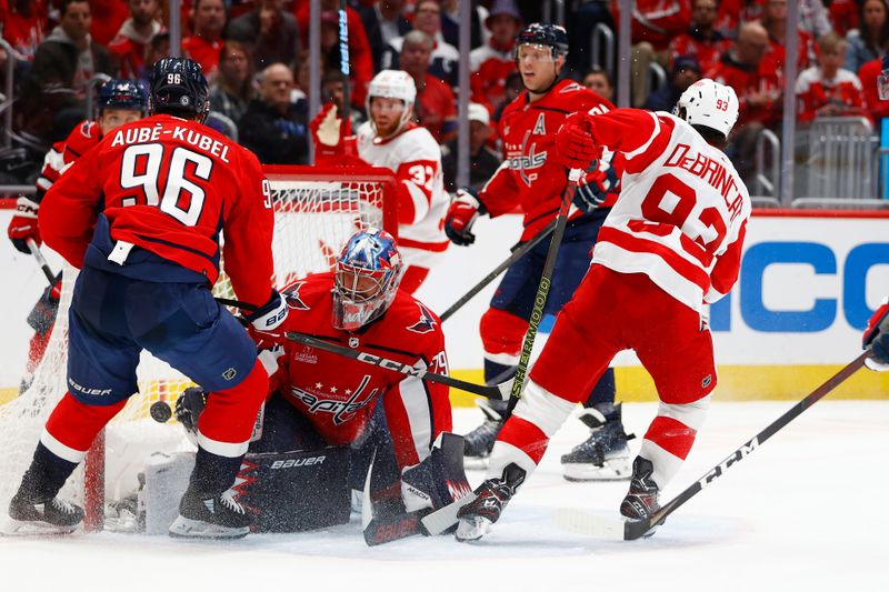 Mar 26, 2024; Washington, District of Columbia, USA;  Detroit Red Wings right wing Alex DeBrincat (93) scores a goal past Washington Capitals goaltender Charlie Lindgren (79) during the second period at Capital One Arena. Mandatory Credit: Amber Searls-USA TODAY Sports