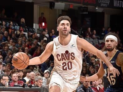 CLEVELAND, OH - December 21: Georges Niang #20 of the Cleveland Cavaliers drives to the basket during the game against the New Orleans Pelicans on December 21, 2023 at Rocket Mortgage FieldHouse in Cleveland, Ohio. NOTE TO USER: User expressly acknowledges and agrees that, by downloading and/or using this Photograph, user is consenting to the terms and conditions of the Getty Images License Agreement. Mandatory Copyright Notice: Copyright 2023 NBAE (Photo by David Liam Kyle/NBAE via Getty Images)