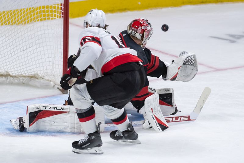 Mar 17, 2024; Ottawa, Ontario, CAN; Ottawa Senators center Mark Kastelic (12) hits the post on his shot against Carolina Hurricanes goalie Frederik Andersn (31) in the third period at the Canadian Tire Centre. Mandatory Credit: Marc DesRosiers-USA TODAY Sports