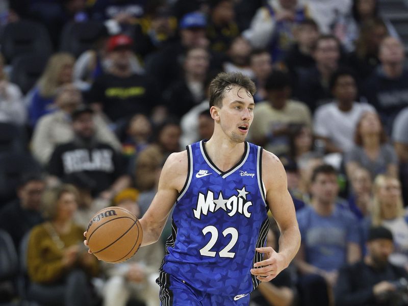 SAN FRANCISCO, CALIFORNIA - JANUARY 02: Franz Wagner #22 of the Orlando Magic dribbles the ball up court against the Golden State Warriors during the second quarter of an NBA basketball game at Chase Center on January 02, 2024 in San Francisco, California. NOTE TO USER: User expressly acknowledges and agrees that, by downloading and or using this photograph, User is consenting to the terms and conditions of the Getty Images License Agreement. (Photo by Thearon W. Henderson/Getty Images)