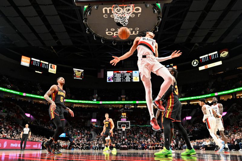 PORTLAND, OREGON - MARCH 13: Dalano Banton #5 of the Portland Trail Blazers dunks the ball during the first quarter of the game against the Atlanta Hawks at the Moda Center on March 13, 2024 in Portland, Oregon. The Portland Trail Blazers won 106-102. NOTE TO USER: User expressly acknowledges and agrees that, by downloading and or using this photograph, User is consenting to the terms and conditions of the Getty Images License Agreement. (Photo by Alika Jenner/Getty Images)