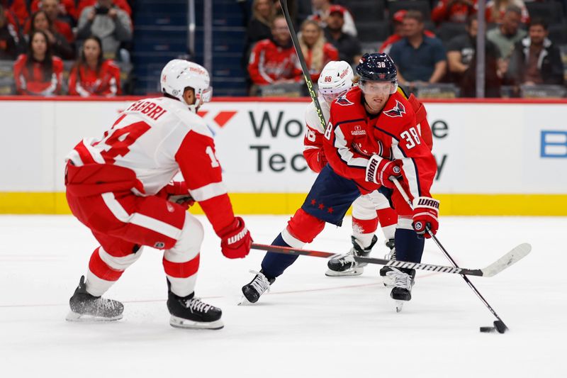 Sep 28, 2023; Washington, District of Columbia, USA; Washington Capitals defenseman Rasmus Sandin (38) skates with the puck as Detroit Red Wings center Robby Fabbri (14) defends in the first period at Capital One Arena. Mandatory Credit: Geoff Burke-USA TODAY Sports