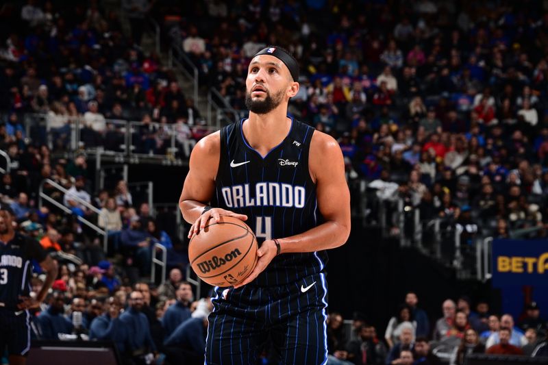 DETROIT, MI - JANUARY 1: Jalen Suggs #4 of the Orlando Magic  free throw during the game against the Detroit Pistons on January 1, 2025 at Little Caesars Arena in Detroit, Michigan. NOTE TO USER: User expressly acknowledges and agrees that, by downloading and/or using this photograph, User is consenting to the terms and conditions of the Getty Images License Agreement. Mandatory Copyright Notice: Copyright 2025 NBAE (Photo by Chris Schwegler/NBAE via Getty Images)