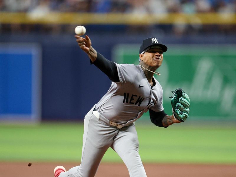 Jul 10, 2024; St. Petersburg, Florida, USA; New York Yankees pitcher Marcus Stroman (0) throws a pitch against the Tampa Bay Rays in the second inning at Tropicana Field. Mandatory Credit: Nathan Ray Seebeck-USA TODAY Sports