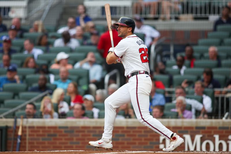 Aug 6, 2024; Atlanta, Georgia, USA; Atlanta Braves first baseman Matt Olson (28) hits a double against the Milwaukee Brewers in the second inning at Truist Park. Mandatory Credit: Brett Davis-USA TODAY Sports

