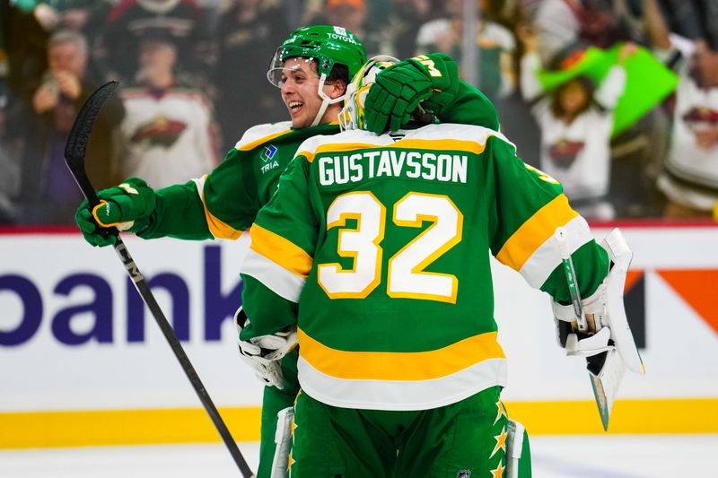 Nov 3, 2024; Saint Paul, Minnesota, USA; Minnesota Wild defenseman Brock Faber (7) celebrates with goaltender Filip Gustavsson (32) following the game against the Toronto Maple Leafs at Xcel Energy Center. Mandatory Credit: Brace Hemmelgarn-Imagn Images