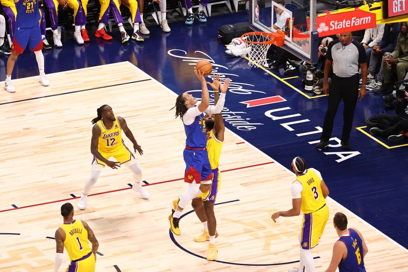 DENVER, CO - OCTOB24ER : Aaron Gordon #50 of the Denver Nuggets shoots the ball during the game against the Los Angeles Lakers on October 24, 2023 at the Ball Arena in Denver, Colorado. NOTE TO USER: User expressly acknowledges and agrees that, by downloading and/or using this Photograph, user is consenting to the terms and conditions of the Getty Images License Agreement. Mandatory Copyright Notice: Copyright 2023 NBAE (Photo by Jamie Schwaberow/NBAE via Getty Images)