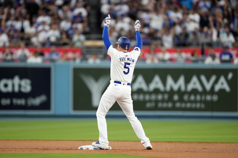 Aug 20, 2024; Los Angeles, California, USA; Los Angeles Dodgers first baseman Freddie Freeman (5) gestures after hitting a double in the first inning against the Seattle Mariners at Dodger Stadium. Mandatory Credit: Kirby Lee-USA TODAY Sports