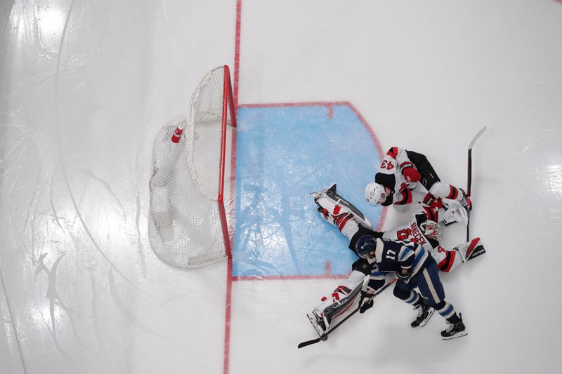 Jan 19, 2024; Columbus, Ohio, USA; New Jersey Devils goalie Vitek Vanecek (41) makes a toe save on the shot from Columbus Blue Jackets right wing Justin Danforth (17) during the third period at Nationwide Arena. Mandatory Credit: Russell LaBounty-USA TODAY Sports