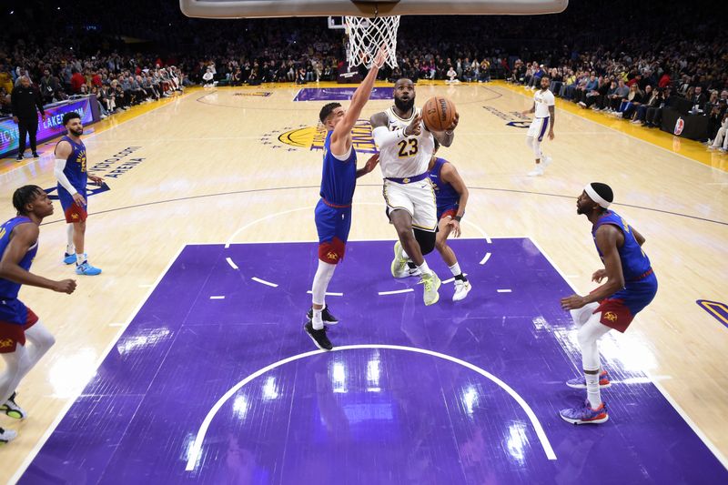 LOS ANGELES, CA - MARCH 2: LeBron James #23 of the Los Angeles Lakers scores his 40,000 career point during the game against the Denver Nuggets on March 2, 2024 at Crypto.Com Arena in Los Angeles, California. NOTE TO USER: User expressly acknowledges and agrees that, by downloading and/or using this Photograph, user is consenting to the terms and conditions of the Getty Images License Agreement. Mandatory Copyright Notice: Copyright 2024 NBAE (Photo by Juan Ocampo/NBAE via Getty Images)