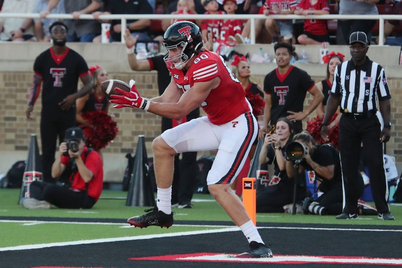 Sep 16, 2023; Lubbock, Texas, USA;  Texas Tech Red Raiders wide receiver Mason Tharp (80) catches a touchdown pass against the Tarleton State Texans in the first half at Jones AT&T Stadium and Cody Campbell Field. Mandatory Credit: Michael C. Johnson-USA TODAY Sports