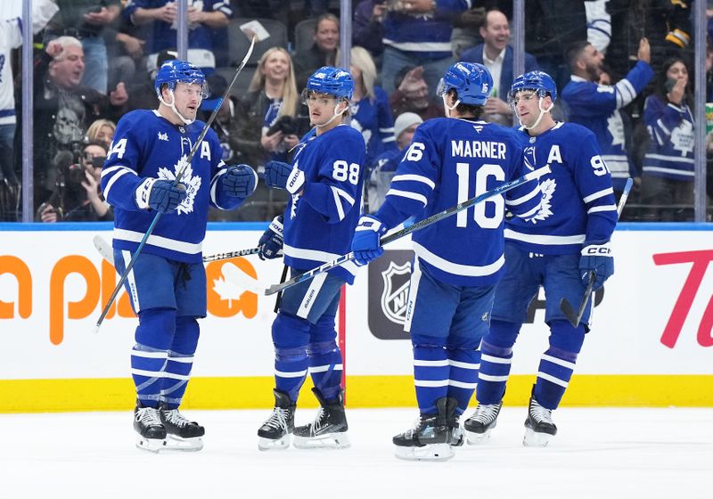 Nov 5, 2024; Toronto, Ontario, CAN; Toronto Maple Leafs defenseman Morgan Rielly (44) scores a goal and celebrates with right wing William Nylander (88) against the Boston Bruins during the second period at Scotiabank Arena. Mandatory Credit: Nick Turchiaro-Imagn Imagess