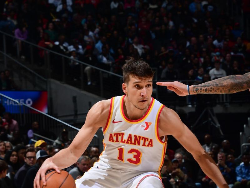 ATLANTA, GA - MARCH 23: Bogdan Bogdanovic #13 of the Atlanta Hawks dribbles the ball during the game against the Charlotte Hornets on March 23, 2024 at State Farm Arena in Atlanta, Georgia.  NOTE TO USER: User expressly acknowledges and agrees that, by downloading and/or using this Photograph, user is consenting to the terms and conditions of the Getty Images License Agreement. Mandatory Copyright Notice: Copyright 2024 NBAE (Photo by Scott Cunningham/NBAE via Getty Images)