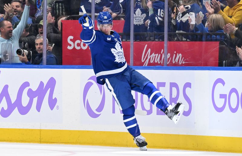 Nov 24, 2024; Toronto, Ontario, CAN;  Toronto Maple Leafs forward Mitch Marner (16) celebrates after scoring a goal against the Utah Hockey Club in the second period at Scotiabank Arena. Mandatory Credit: Dan Hamilton-Imagn Images