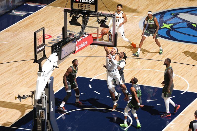 MINNEAPOLIS, MN -  NOVEMBER 1: Aaron Gordon #32 of the Denver Nuggets drives to the basket during the game against the Minnesota Timberwolves on November 1, 2024 at Target Center in Minneapolis, Minnesota. NOTE TO USER: User expressly acknowledges and agrees that, by downloading and or using this Photograph, user is consenting to the terms and conditions of the Getty Images License Agreement. Mandatory Copyright Notice: Copyright 2024 NBAE (Photo by David Sherman/NBAE via Getty Images)