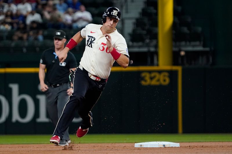 Sep 6, 2024; Arlington, Texas, USA; Texas Rangers first baseman Nathaniel Lowe (30) advances to third base during the second inning against the Los Angeles Angels at Globe Life Field. Mandatory Credit: Raymond Carlin III-Imagn Images