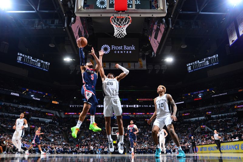 SAN ANTONIO, TX - JANUARY 29:  Tyus Jones #5 of the Washington Wizards drives to the basket during the game  against the San Antonio Spurs on January 29, 2024 at the Frost Bank Center in San Antonio, Texas. NOTE TO USER: User expressly acknowledges and agrees that, by downloading and or using this photograph, user is consenting to the terms and conditions of the Getty Images License Agreement. Mandatory Copyright Notice: Copyright 2024 NBAE (Photos by Michael Gonzales/NBAE via Getty Images)