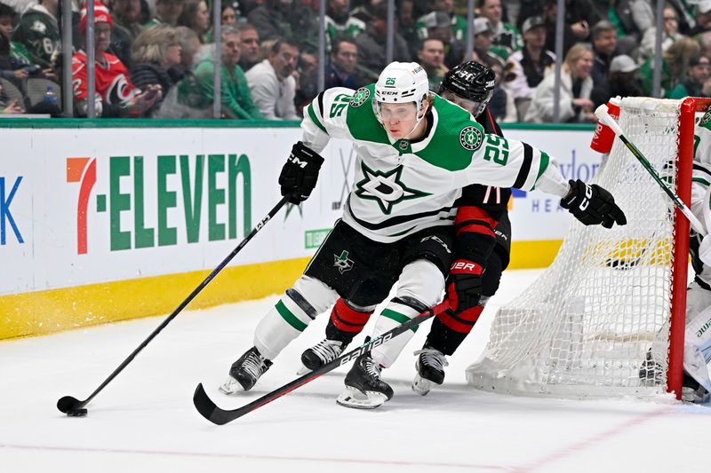 Jan 25, 2023; Dallas, Texas, USA; Dallas Stars left wing Joel Kiviranta (25) brings the puck out of the Stars zone as Carolina Hurricanes right wing Jesper Fast (71) gives chase during the first period at the American Airlines Center. Mandatory Credit: Jerome Miron-USA TODAY Sports