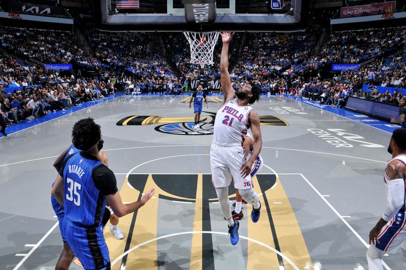 ORLANDO, FL - NOVEMBER 15: Joel Embiid #21 of the Philadelphia 76ers goes up for the rebound during the game against the Orlando Magic during the Emirates NBA Cup game on  November 15, 2024 at Kia Center in Orlando, Florida. NOTE TO USER: User expressly acknowledges and agrees that, by downloading and or using this photograph, User is consenting to the terms and conditions of the Getty Images License Agreement. Mandatory Copyright Notice: Copyright 2024 NBAE (Photo by Fernando Medina/NBAE via Getty Images)