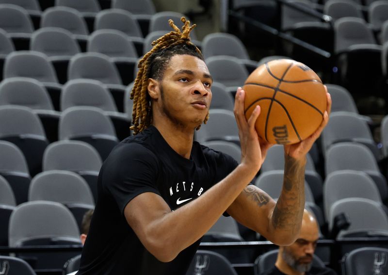 SAN ANTONIO, TX - MARCH 4: Noah Clowney #21 of the Brooklyn Nets takes warm-up shots before their game against the San Antonio Spurs at Frost Bank Center on March 4, 2025 in San Antonio, Texas. NOTE TO USER: User expressly acknowledges and agrees that, by downloading and or using this photograph, User is consenting to terms and conditions of the Getty Images License Agreement. (Photo by Ronald Cortes/Getty Images)