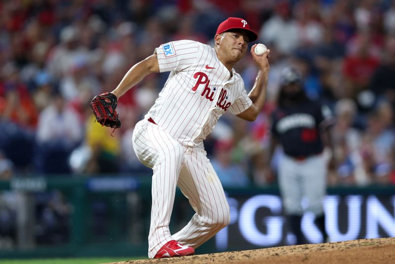 Sep 27, 2025; Philadelphia, Pennsylvania, USA; Philadelphia Phillies pitcher Ranger Suarez (55) attempts to make a play at first after being hit with a line drive during the fifth inning against the Minnesota Twins at Citizens Bank Park. Mandatory Credit: Bill Streicher-Imagn Images