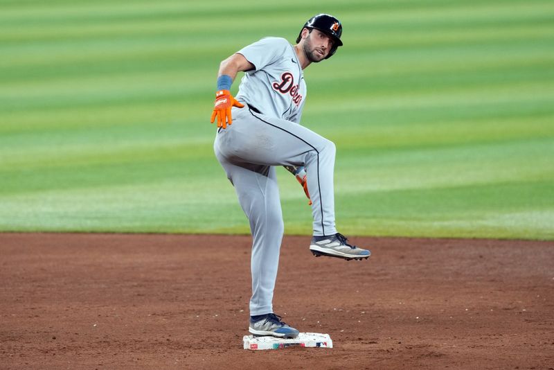 May 19, 2024; Phoenix, Arizona, USA; Detroit Tigers third base Matt Vierling (8) celebrates after hitting an RBI double against the Arizona Diamondbacks during the sixth inning at Chase Field. Mandatory Credit: Joe Camporeale-USA TODAY Sports