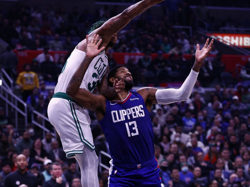 LOS ANGELES, CALIFORNIA - DECEMBER 12:  Paul George #13 of the LA Clippers is fouled by Marcus Smart #36 of the Boston Celtics in the second half at Crypto.com Arena on December 12, 2022 in Los Angeles, California.  NOTE TO USER: User expressly acknowledges and agrees that, by downloading and/or using this photograph, user is consenting to the terms and conditions of the Getty Images License Agreement.  (Photo by Ronald Martinez/Getty Images)