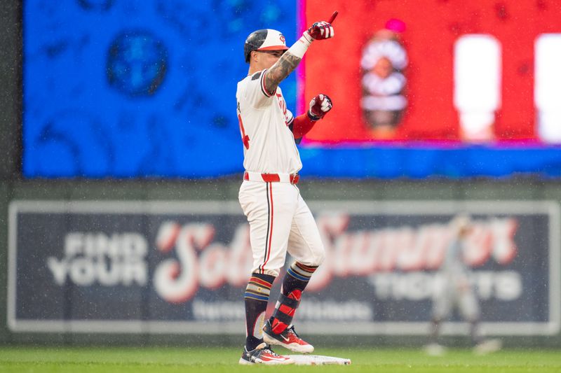 Jul 4, 2024; Minneapolis, Minnesota, USA; Minnesota Twins third baseman Jose Miranda (64) reacts after hitting a double in the seventh inning against Detroit Tigers at Target Field. Mandatory Credit: Matt Blewett-USA TODAY Sports