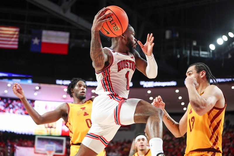 Feb 19, 2024; Houston, Texas, USA; Houston Cougars guard Jamal Shead (1) looks to pass the ball during the second half against the Iowa State Cyclones at Fertitta Center. Mandatory Credit: Troy Taormina-USA TODAY Sports