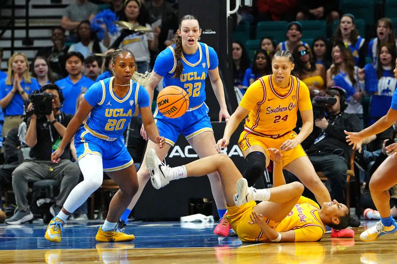 Mar 8, 2024; Las Vegas, NV, USA; USC Trojans guard JuJu Watkins (12) loses the ball in front of UCLA Bruins guard Charisma Osborne (20), UCLA Bruins forward Angela Dugalic (32), and USC Trojans forward Kaitlyn Davis (24) during the first quarter at MGM Grand Garden Arena. Mandatory Credit: Stephen R. Sylvanie-USA TODAY Sports