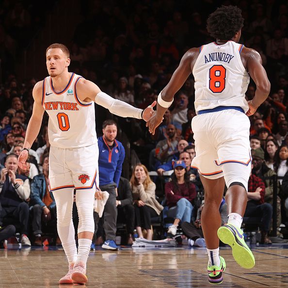 NEW YORK, NY - JANUARY 1: Donte Divincenzo #0 and OG Anunoby #8 of the New York Knicks high five during the game against the Minnesota Timberwolves on January 1, 2024 at Madison Square Garden in New York City, New York.  NOTE TO USER: User expressly acknowledges and agrees that, by downloading and or using this photograph, User is consenting to the terms and conditions of the Getty Images License Agreement. Mandatory Copyright Notice: Copyright 2024 NBAE  (Photo by Nathaniel S. Butler/NBAE via Getty Images)