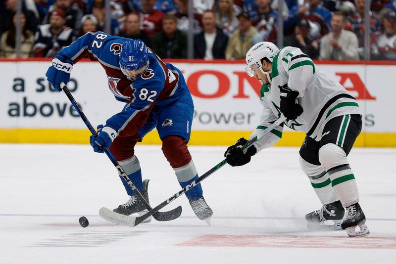 May 13, 2024; Denver, Colorado, USA; Colorado Avalanche defenseman Caleb Jones (82) and Dallas Stars center Logan Stankoven (11) battle for the puck in the second period in game four of the second round of the 2024 Stanley Cup Playoffs at Ball Arena. Mandatory Credit: Isaiah J. Downing-USA TODAY Sports