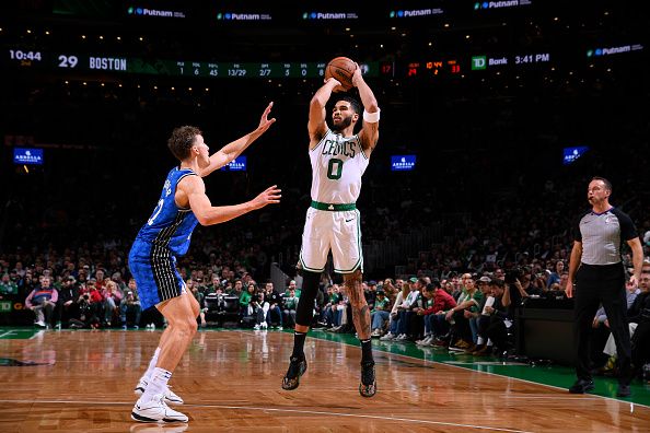 BOSTON, MA - DECEMBER 17: Jayson Tatum #0 of the Boston Celtics shoots a three point basket during the game against the Orlando Magic on December 17, 2023 at the TD Garden in Boston, Massachusetts. NOTE TO USER: User expressly acknowledges and agrees that, by downloading and or using this photograph, User is consenting to the terms and conditions of the Getty Images License Agreement. Mandatory Copyright Notice: Copyright 2023 NBAE  (Photo by Brian Babineau/NBAE via Getty Images)