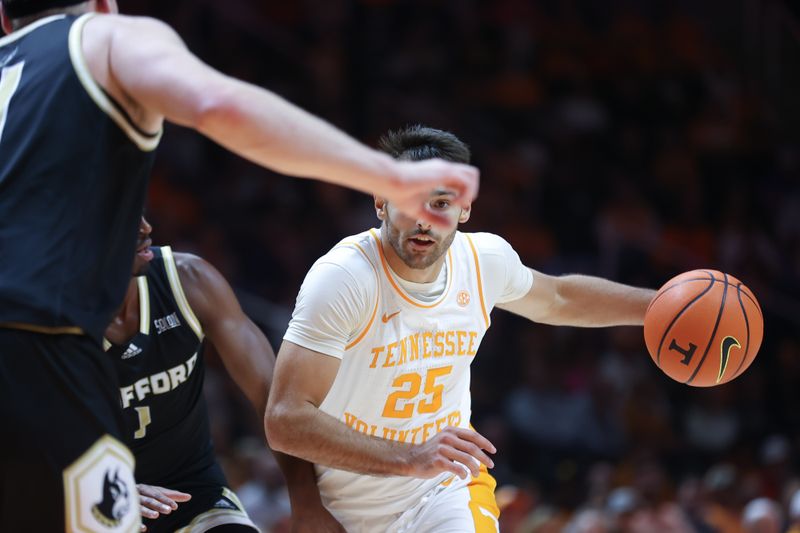 Nov 14, 2023; Knoxville, Tennessee, USA; Tennessee Volunteers guard Santiago Vescovi (25) moves the ball against the Wofford Terriers during the first half at Thompson-Boling Arena at Food City Center. Mandatory Credit: Randy Sartin-USA TODAY Sports