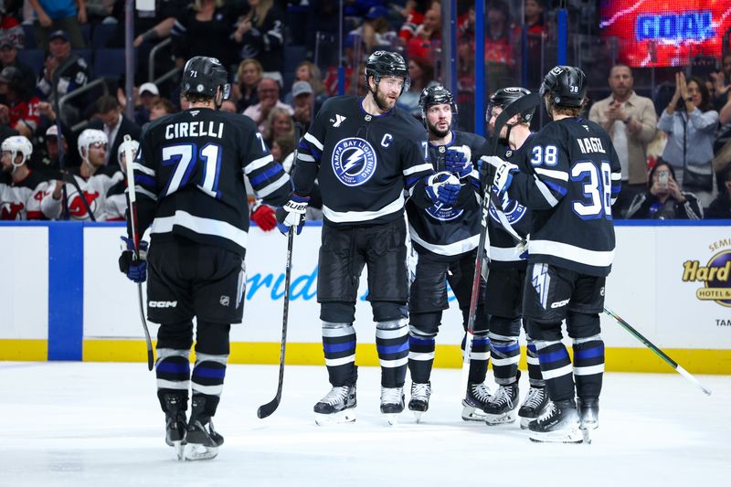 Nov 16, 2024; Tampa, Florida, USA;  Tampa Bay Lightning defenseman Victor Hedman (77) celebrates after scoring a goal against the New Jersey Devils in the third period at Amalie Arena. Mandatory Credit: Nathan Ray Seebeck-Imagn Images