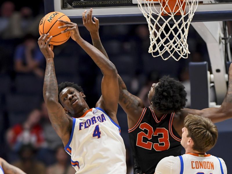 Mar 14, 2024; Nashville, TN, USA;  Georgia Bulldogs forward Jalen DeLoach (23) and Florida Gators forward Tyrese Samuel (4) fight for the rebound during the second half at Bridgestone Arena. Mandatory Credit: Steve Roberts-USA TODAY Sports