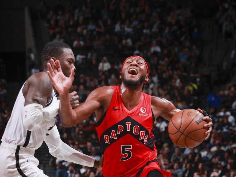 BROOKLYN, NY - OCTOBER 18: Immanuel Quickley #5 of the Toronto Raptors drives to the basket during the game on October 18, 2024 at Barclays Center in Brooklyn, New York. NOTE TO USER: User expressly acknowledges and agrees that, by downloading and or using this Photograph, user is consenting to the terms and conditions of the Getty Images License Agreement. Mandatory Copyright Notice: Copyright 2024 NBAE (Photo by Nathaniel S. Butler/NBAE via Getty Images)