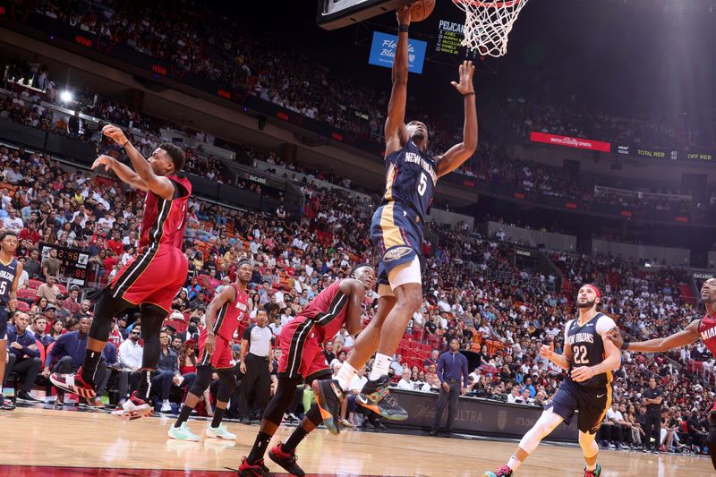 MIAMI, FL - JANUARY 22: Herbert Jones #5 of the New Orleans Pelicans drives to the basket during the game against the Miami Heat on January 22, 2023 at Miami-Dade Arena in Miami, Florida. NOTE TO USER: User expressly acknowledges and agrees that, by downloading and or using this Photograph, user is consenting to the terms and conditions of the Getty Images License Agreement. Mandatory Copyright Notice: Copyright 2023 NBAE (Photo by Nathaniel S. Butler/NBAE via Getty Images)