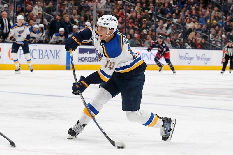 Dec 8, 2023; Columbus, Ohio, USA; St. Louis Blues center Brayden Schenn (10) wrists a shot on goal against the Columbus Blue Jackets during the third period at Nationwide Arena. Mandatory Credit: Russell LaBounty-USA TODAY Sports