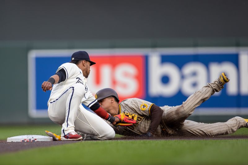 May 10, 2023; Minneapolis, Minnesota, USA; San Diego Padres left fielder Juan Soto (22) slides safely into second base after stealing before Minnesota Twins second baseman Jorge Polanco (11) can make the tag in the second inning at Target Field. Mandatory Credit: Jesse Johnson-USA TODAY Sports