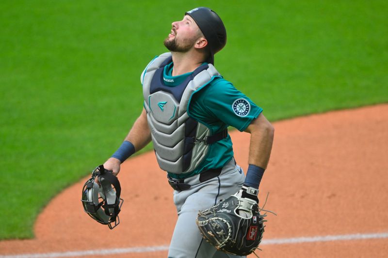 Jun 18, 2024; Cleveland, Ohio, USA; Seattle Mariners catcher Cal Raleigh (29) looks for a foul ball in the first inning against the Cleveland Guardians at Progressive Field. Mandatory Credit: David Richard-USA TODAY Sports