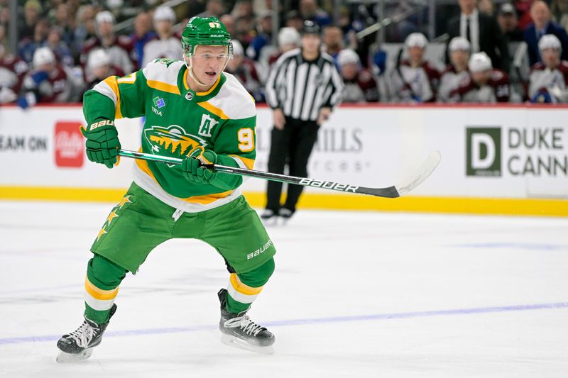 Nov 24, 2023; Saint Paul, Minnesota, USA; Minnesota Wild forward Kirill Kaprizov (97) makes a pass against the Colorado Avalanche during the second period at Xcel Energy Center. Mandatory Credit: Nick Wosika-USA TODAY Sports