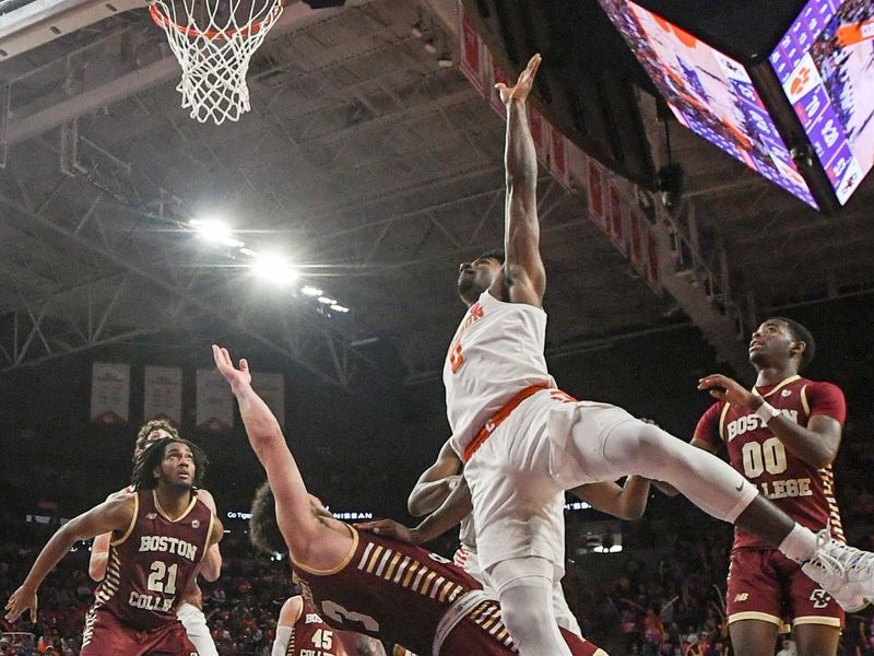 Jan 13, 2024; Clemson, South Carolina, USA; Clemson Tigers guard Joshua Beadle (0) scores against the Boston College Eagles during the second half at Littlejohn Coliseum. Mandatory Credit: Ken Ruinard-USA TODAY Sports