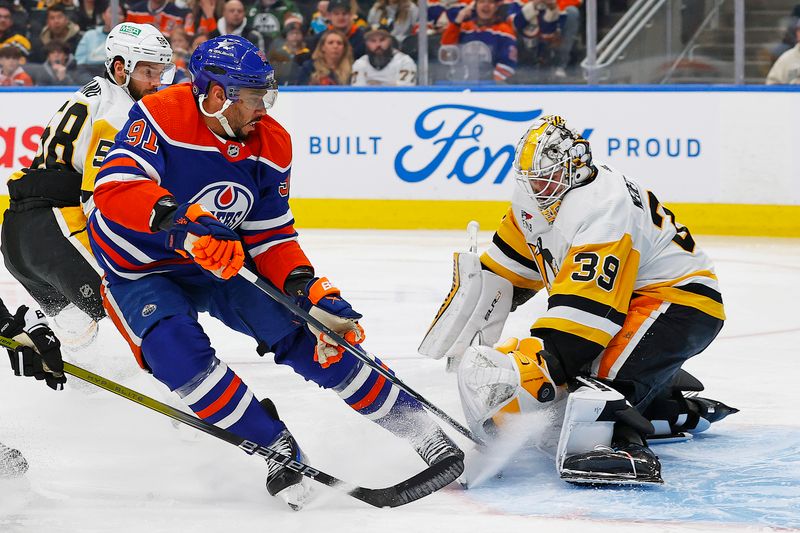 Mar 3, 2024; Edmonton, Alberta, CAN; Pittsburgh Penguins goaltender Alex Nedeljkovic (39) makes a save on  on Edmonton Oilers forward Evander Kane (91) during the third period at Rogers Place. Mandatory Credit: Perry Nelson-USA TODAY Sports