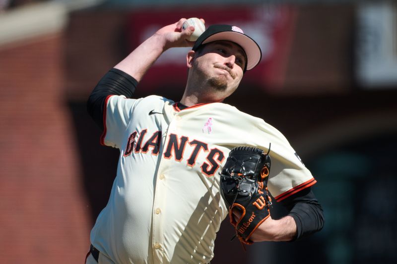 May 12, 2024; San Francisco, California, USA; San Francisco Giants pitcher Luke Jackson (77) throws a pitch against the Cincinnati Reds during the tenth inning at Oracle Park. Mandatory Credit: Robert Edwards-USA TODAY Sports