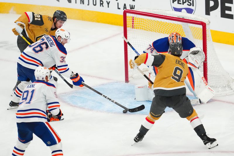 May 14, 2025; Las Vegas, Nevada, USA; Edmonton Oilers defenseman John Klingberg (36) deflects a centering pass attempt from Vegas Golden Knights center Jack Eichel (9) to center Brett Howden (21) during the third period of game five of the second round of the 2025 Stanley Cup Playoffs at T-Mobile Arena. Mandatory Credit: Stephen R. Sylvanie-Imagn Images