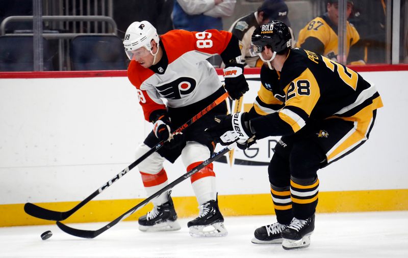 Feb 25, 2024; Pittsburgh, Pennsylvania, USA;  Philadelphia Flyers right wing Cam Atkinson (89) moves the puck against Pittsburgh Penguins defenseman Marcus Pettersson (28) during the third period at PPG Paints Arena.  Pittsburgh won 7-6. Mandatory Credit: Charles LeClaire-USA TODAY Sports