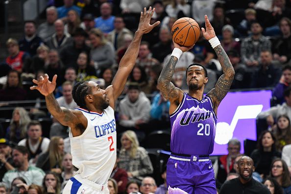 SALT LAKE CITY, UTAH - DECEMBER 08: John Collins #20 of the Utah Jazz shoots over Kawhi Leonard #2 of the LA Clippers during the first half of a game at Delta Center on December 08, 2023 in Salt Lake City, Utah. NOTE TO USER: User expressly acknowledges and agrees that, by downloading and or using this photograph, User is consenting to the terms and conditions of the Getty Images License Agreement. (Photo by Alex Goodlett/Getty Images)